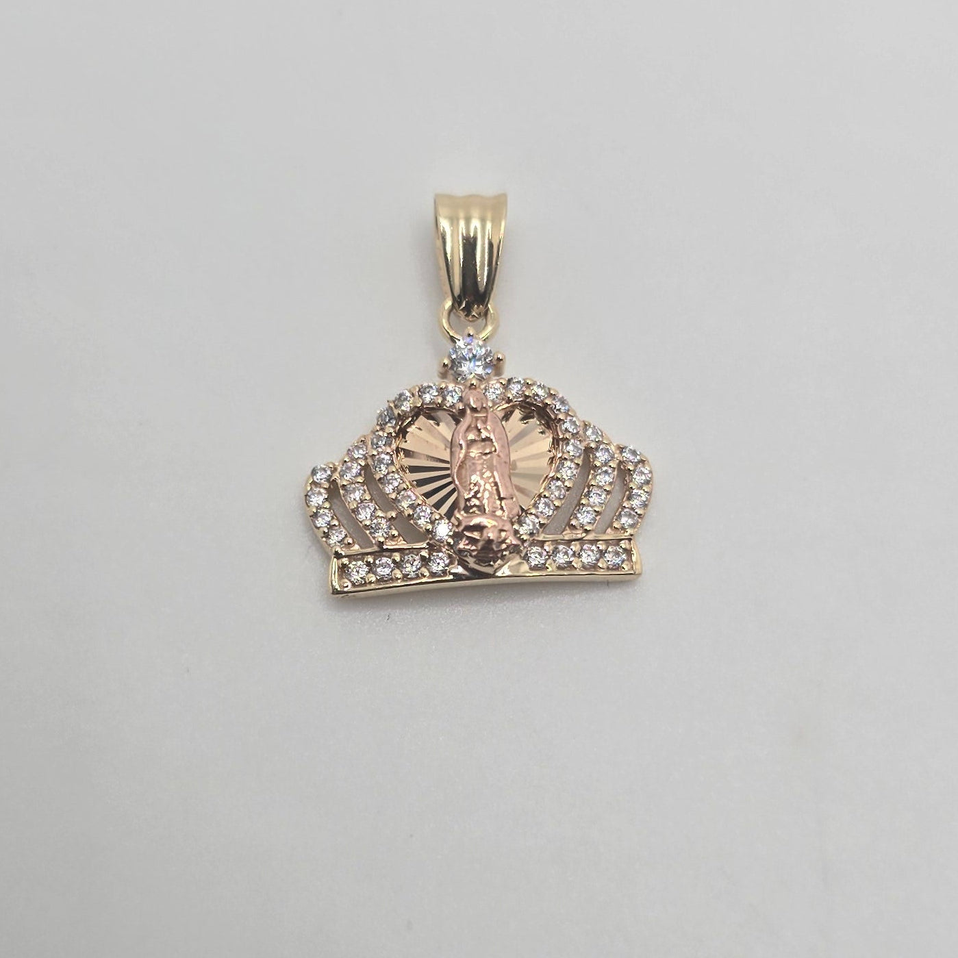 Gold pendant of the Virgin Mary's crown