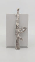 Dije de Rifle de plata