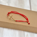 Thin cross charm bracelet
